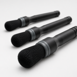 Close-up of soft black bristles on three car interior detailing brushes