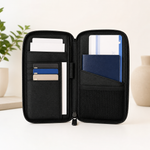 Open black passport holder wallet with organised travel document compartments