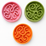 Pink green and orange slow feeder bowl maze patterns