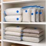 Compressed vacuum storage bags arranged on linen cupboard shelves