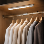 Motion sensor light illuminating clothes inside a wardrobe